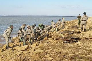 Oil spill clean up on a beach